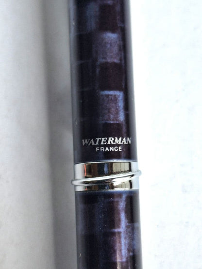 Waterman ballpoint pen with blue and black marble pattern and simple clip on metal and plastic body