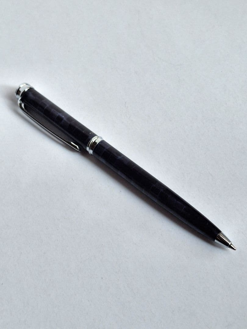 Waterman ballpoint pen with blue and black marble pattern and simple clip on metal and plastic body