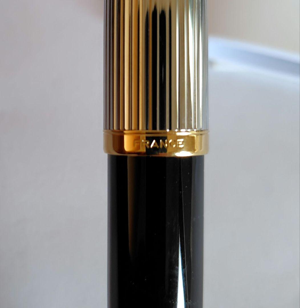 Waterman ballpoint pen with company name marking, unused with slight discoloration on clip