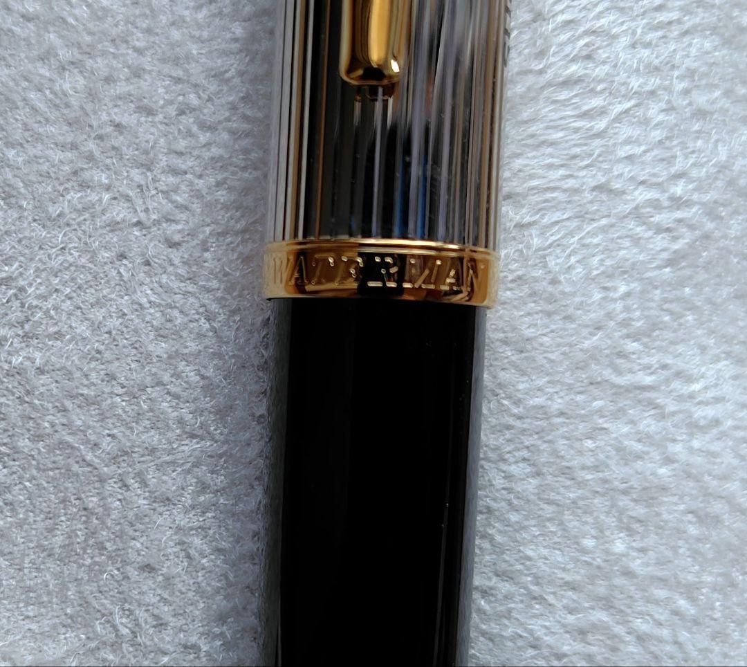 Waterman ballpoint pen with company name marking, unused with slight discoloration on clip