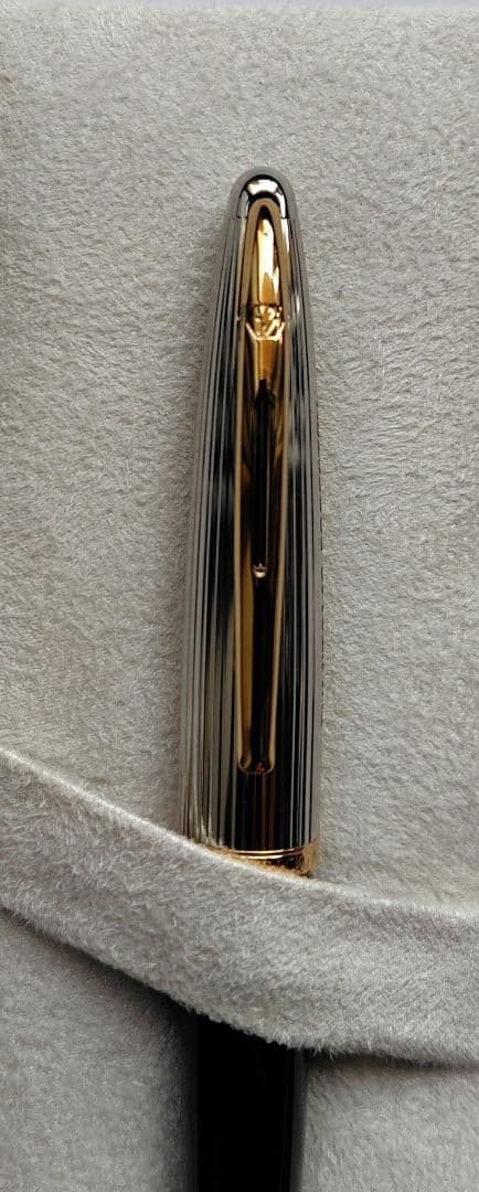 Waterman ballpoint pen with company name marking, unused with slight discoloration on clip