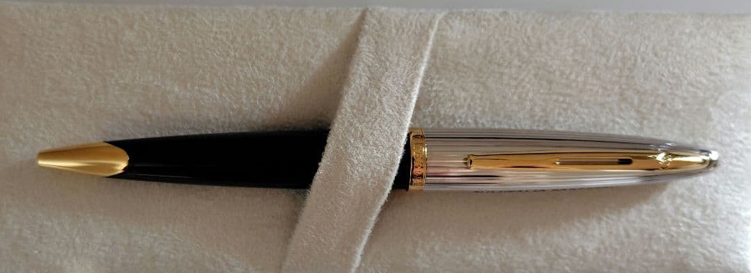 Waterman ballpoint pen with company name marking, unused with slight discoloration on clip