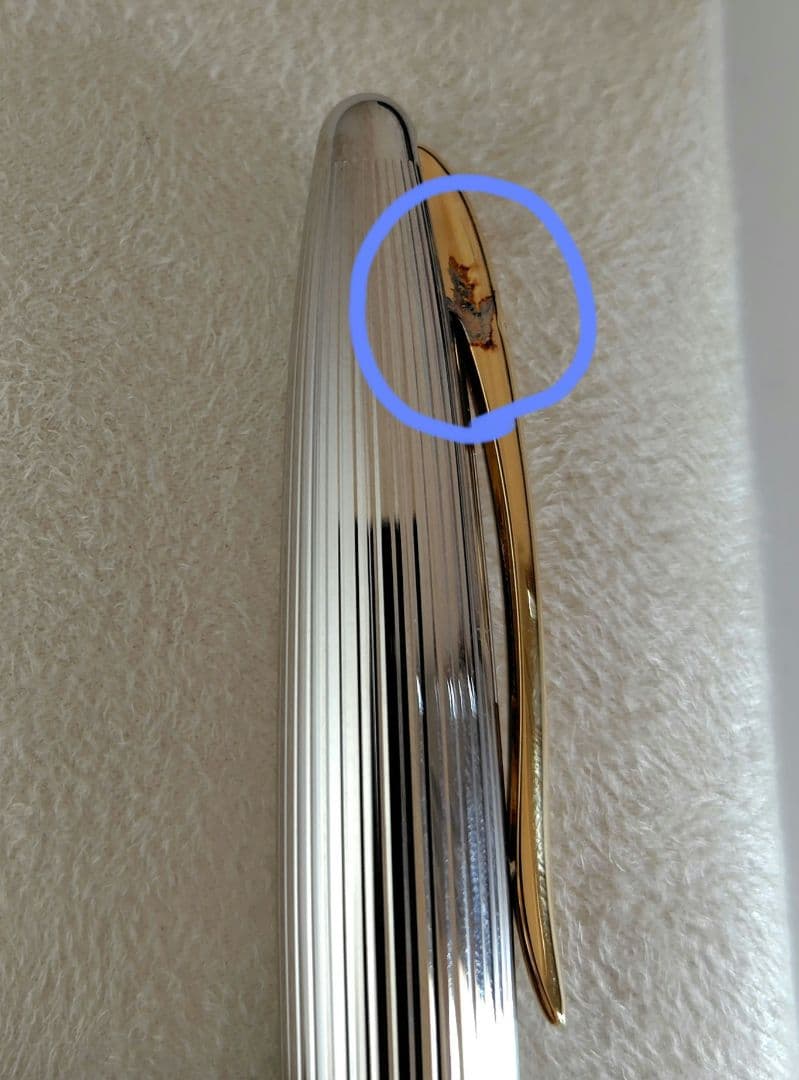 Waterman ballpoint pen with company name marking, unused with slight discoloration on clip