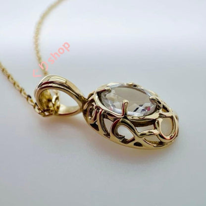 Agete K10 YG11 necklace with a 7.7mm by 5.7mm topaz gemstone on a 40cm gold chain