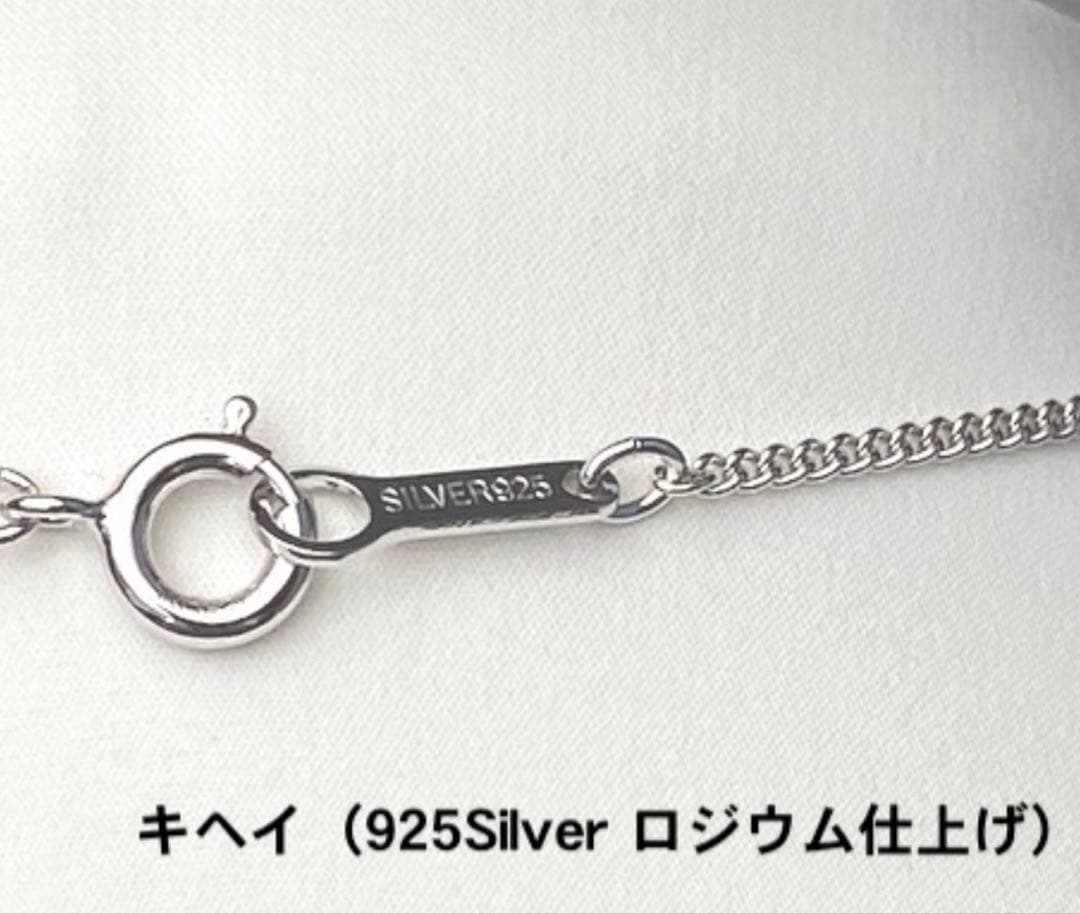 Akoya pearl pendant necklace with 7mm pearl, cubic zirconia accents, and silver 925 rhodium plated chain on white background