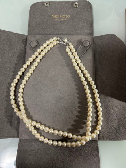 Mikimoto two-row pearl necklace featuring 6mm freshwater pearls with 42cm length, displayed on a white background