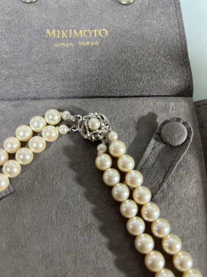 Mikimoto two-row pearl necklace featuring 6mm freshwater pearls with 42cm length, displayed on a white background