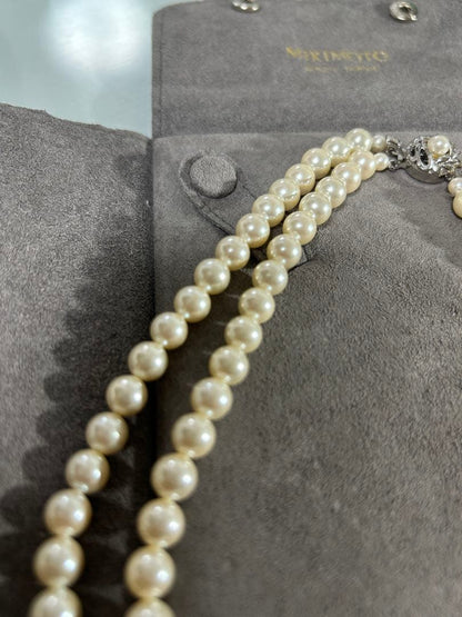 Mikimoto two-row pearl necklace featuring 6mm freshwater pearls with 42cm length, displayed on a white background