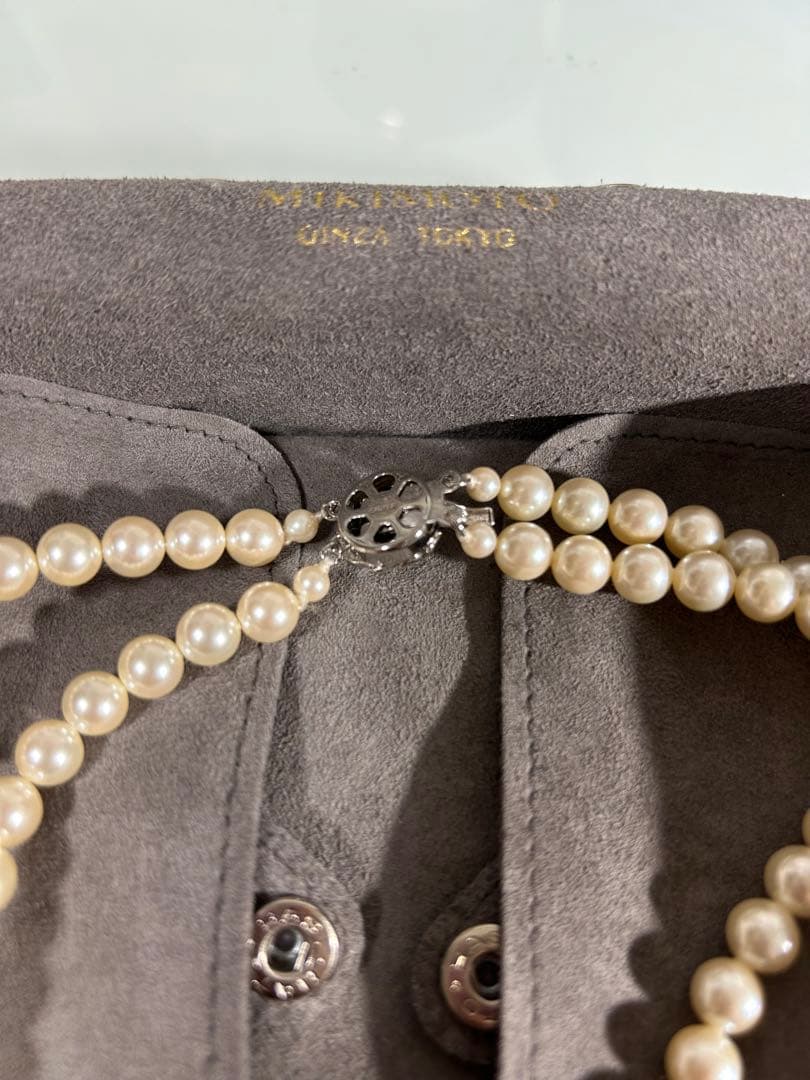 Mikimoto two-row pearl necklace featuring 6mm freshwater pearls with 42cm length, displayed on a white background