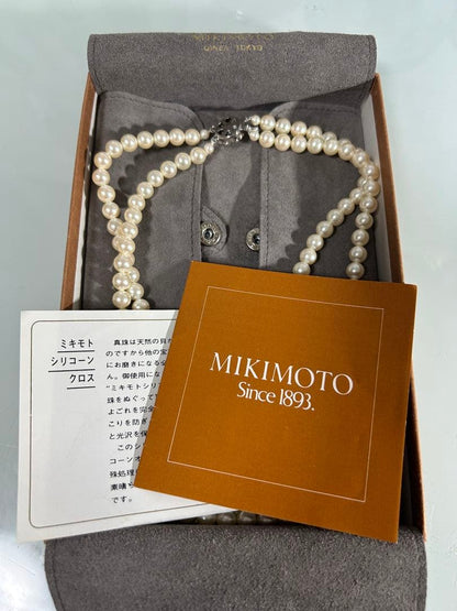 Mikimoto two-row pearl necklace featuring 6mm freshwater pearls with 42cm length, displayed on a white background
