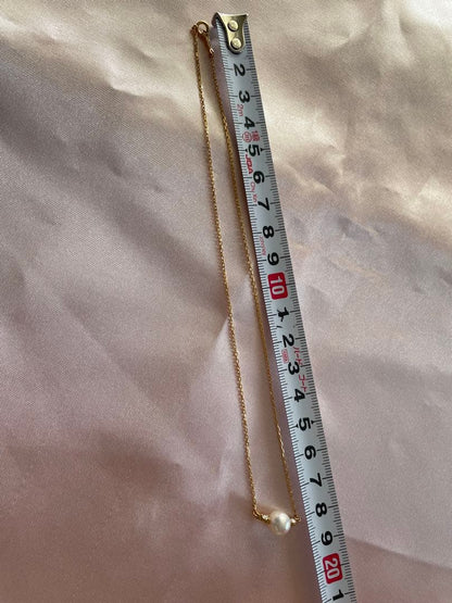 Mikimoto K18 Akoya pearl necklace with 7.4mm pearls and 37cm gold chain displayed on white background