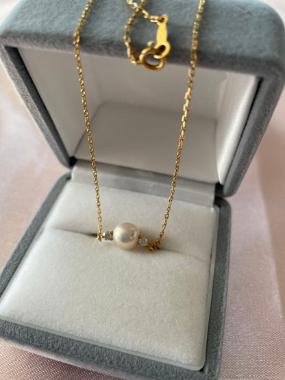 Mikimoto K18 Akoya pearl necklace with 7.4mm pearls and 37cm gold chain displayed on white background