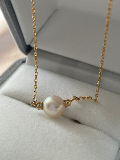 Mikimoto K18 Akoya pearl necklace with 7.4mm pearls and 37cm gold chain displayed on white background