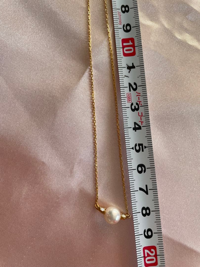 Mikimoto K18 Akoya pearl necklace with 7.4mm pearls and 37cm gold chain displayed on white background