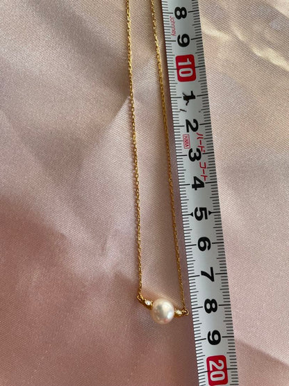 Mikimoto K18 Akoya pearl necklace with 7.4mm pearls and 37cm gold chain displayed on white background