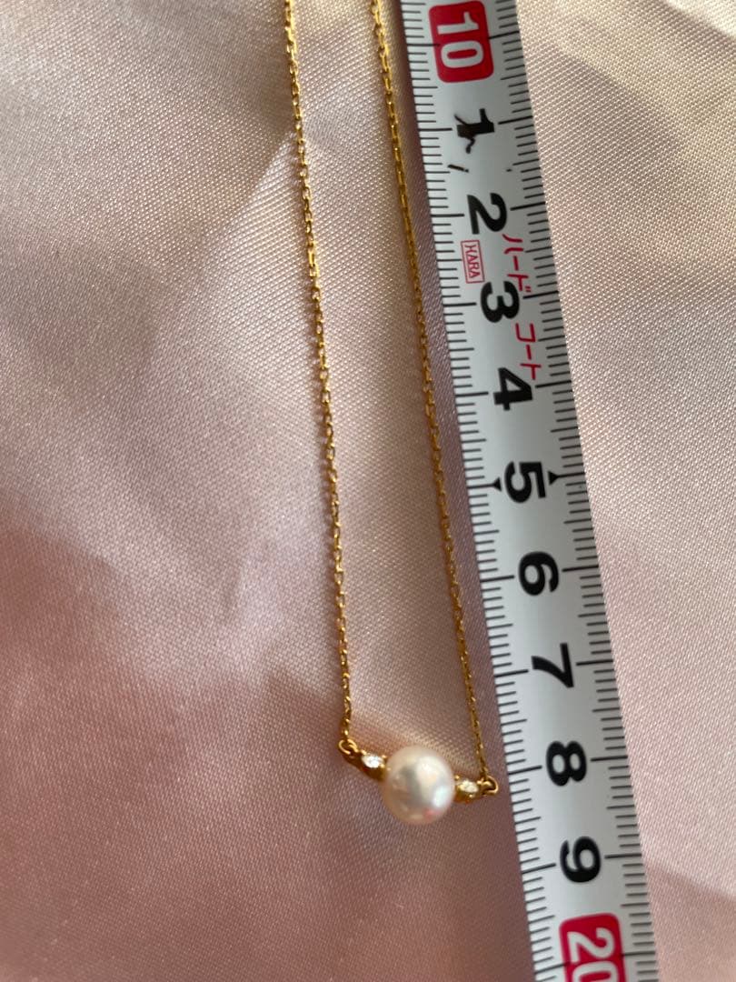 Mikimoto K18 Akoya pearl necklace with 7.4mm pearls and 37cm gold chain displayed on white background