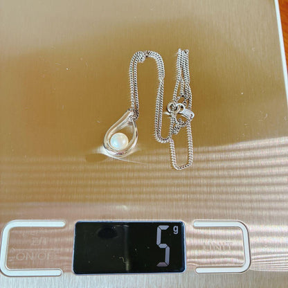Tasaki pearl necklace with teardrop shaped pendant on a 42 cm sterling silver chain
