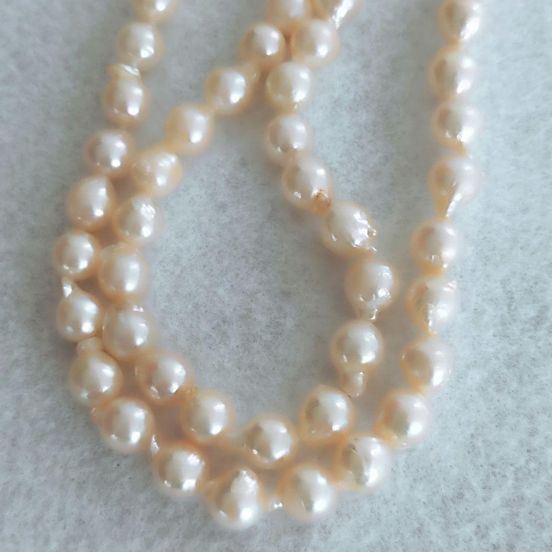 Akoya baroque pearl necklace in white with silver stamp, 42 cm length, displayed on a white background