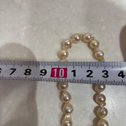 Akoya baroque pearl necklace in white with silver stamp, 42 cm length, displayed on a white background