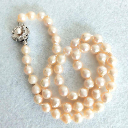 Akoya baroque pearl necklace in white with silver stamp, 42 cm length, displayed on a white background