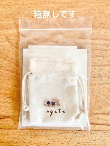 Gold dangling earrings with blue lapis lazuli stones in elegant design