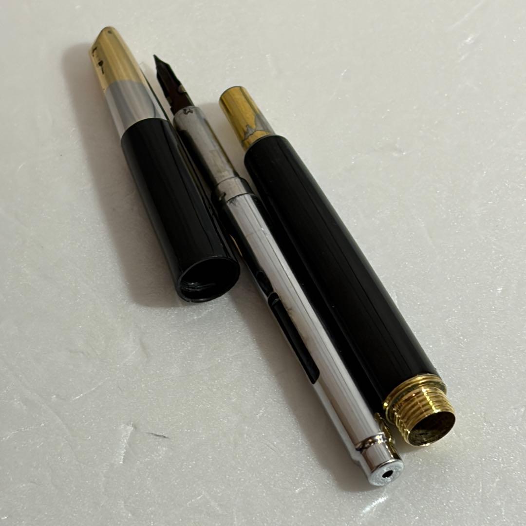 Used Pilot Capless Initial Model fountain pen with 14K gold nib, showing body crack and signs of wear