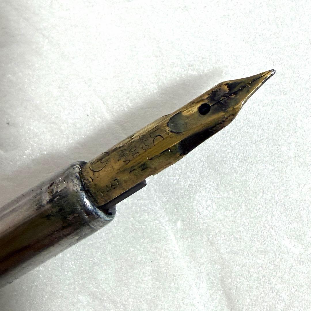 Used Pilot Capless Initial Model fountain pen with 14K gold nib, showing body crack and signs of wear