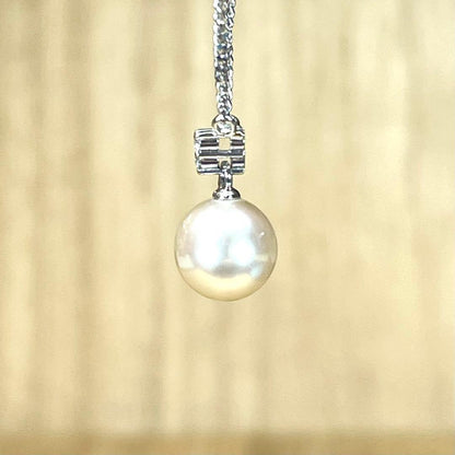 Tasaki Pt850 necklace featuring a 7.6mm Akoya pearl with three small diamonds total 0.04 ct