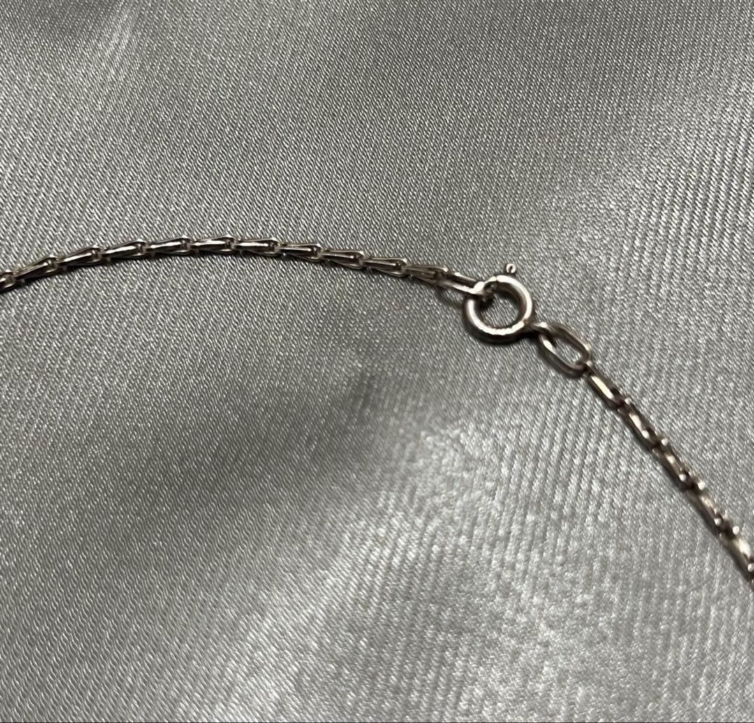 Silver Agate Cross Charm approximately 2.4 cm by 1.5 cm on a 41 cm silver chain