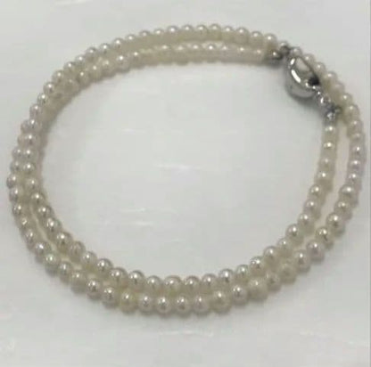 Akoya pearl baby necklace with small round pearls measuring 3.5 to 3.9mm on a 42cm chain