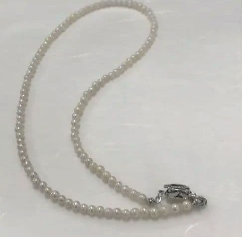 Akoya pearl baby necklace with small round pearls measuring 3.5 to 3.9mm on a 42cm chain