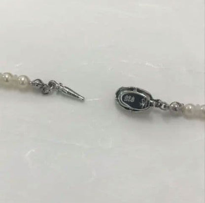 Akoya pearl baby necklace with small round pearls measuring 3.5 to 3.9mm on a 42cm chain