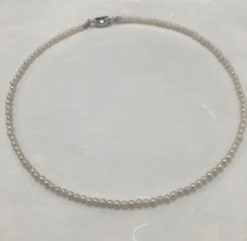 Akoya pearl baby necklace with small round pearls measuring 3.5 to 3.9mm on a 42cm chain
