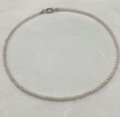 Akoya pearl baby necklace with small round pearls measuring 3.5 to 3.9mm on a 42cm chain