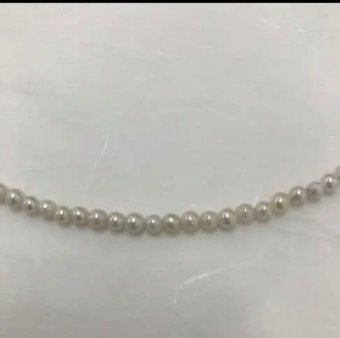 Akoya pearl baby necklace with small round pearls measuring 3.5 to 3.9mm on a 42cm chain