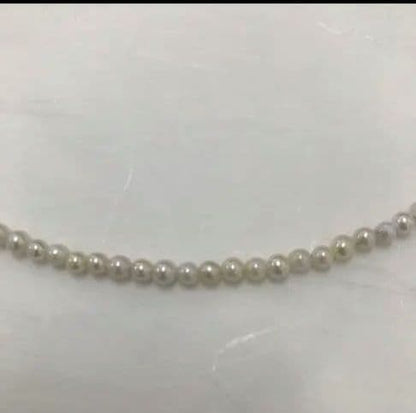 Akoya pearl baby necklace with small round pearls measuring 3.5 to 3.9mm on a 42cm chain