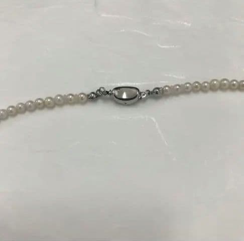 Akoya pearl baby necklace with small round pearls measuring 3.5 to 3.9mm on a 42cm chain