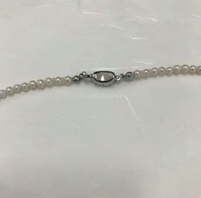 Akoya pearl baby necklace with small round pearls measuring 3.5 to 3.9mm on a 42cm chain