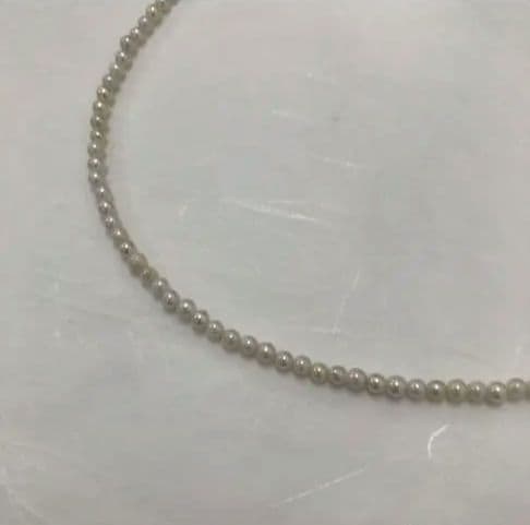 Akoya pearl baby necklace with small round pearls measuring 3.5 to 3.9mm on a 42cm chain