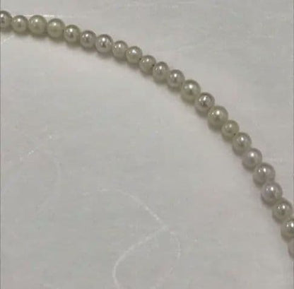 Akoya pearl baby necklace with small round pearls measuring 3.5 to 3.9mm on a 42cm chain