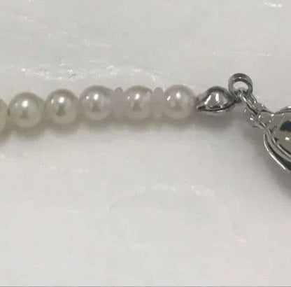 Akoya pearl baby necklace with small round pearls measuring 3.5 to 3.9mm on a 42cm chain