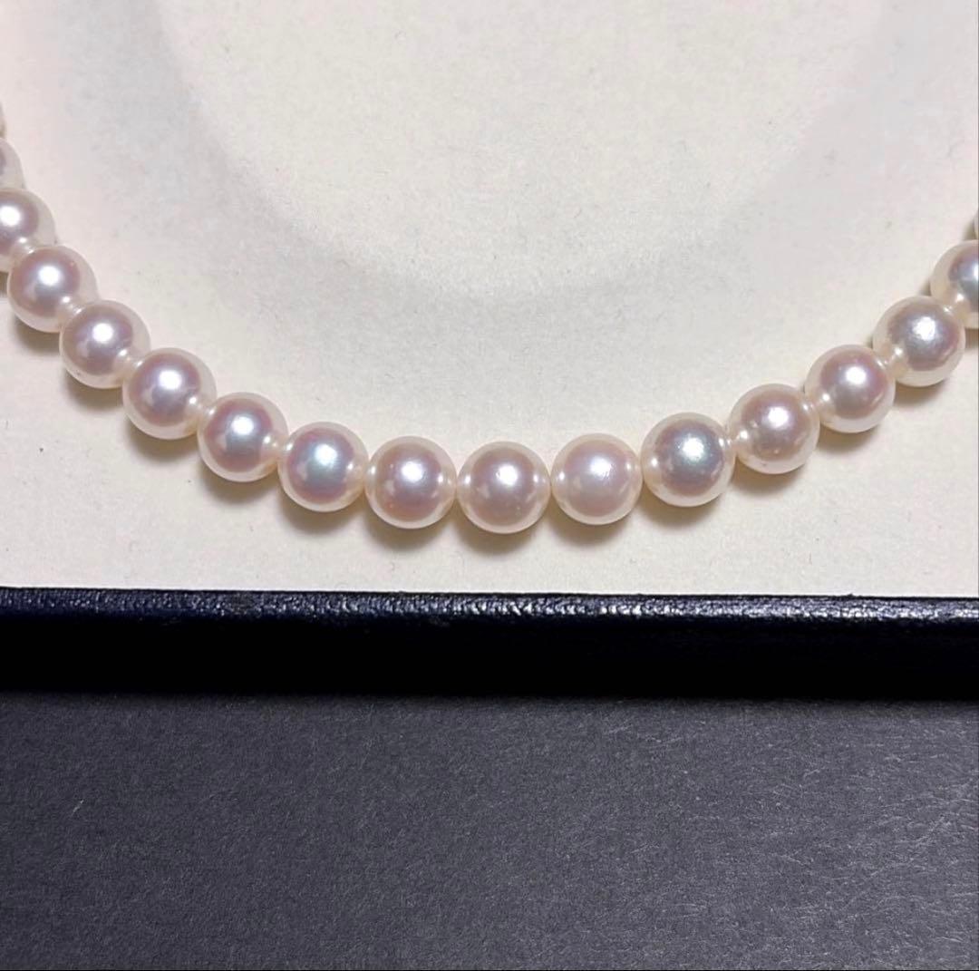 TASAKI Akoya Pearl Necklace with 8.0-8.5 mm pearls and 42 cm length displayed on a black background