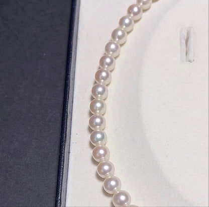 TASAKI Akoya Pearl Necklace with 8.0-8.5 mm pearls and 42 cm length displayed on a black background