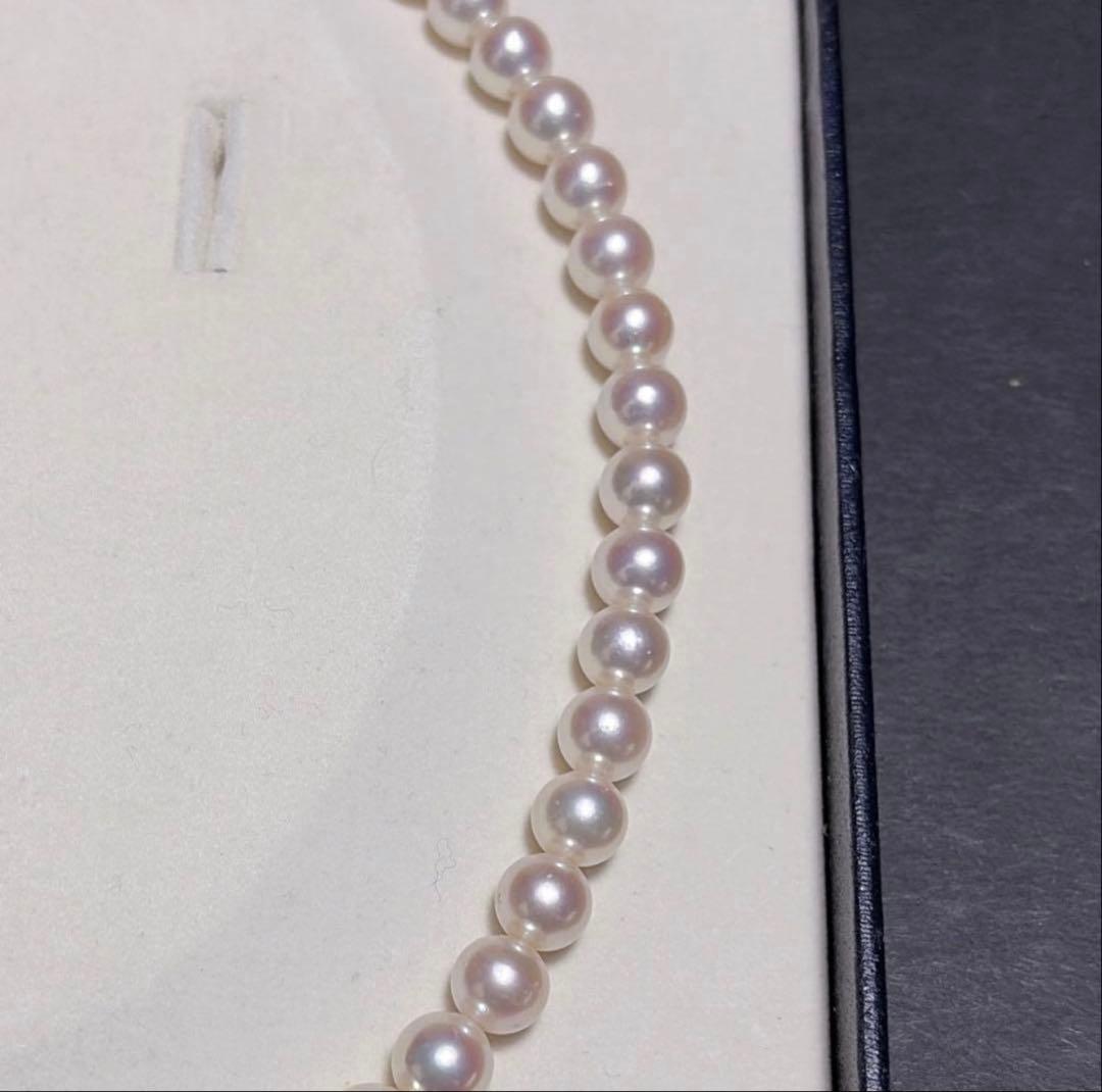 TASAKI Akoya Pearl Necklace with 8.0-8.5 mm pearls and 42 cm length displayed on a black background