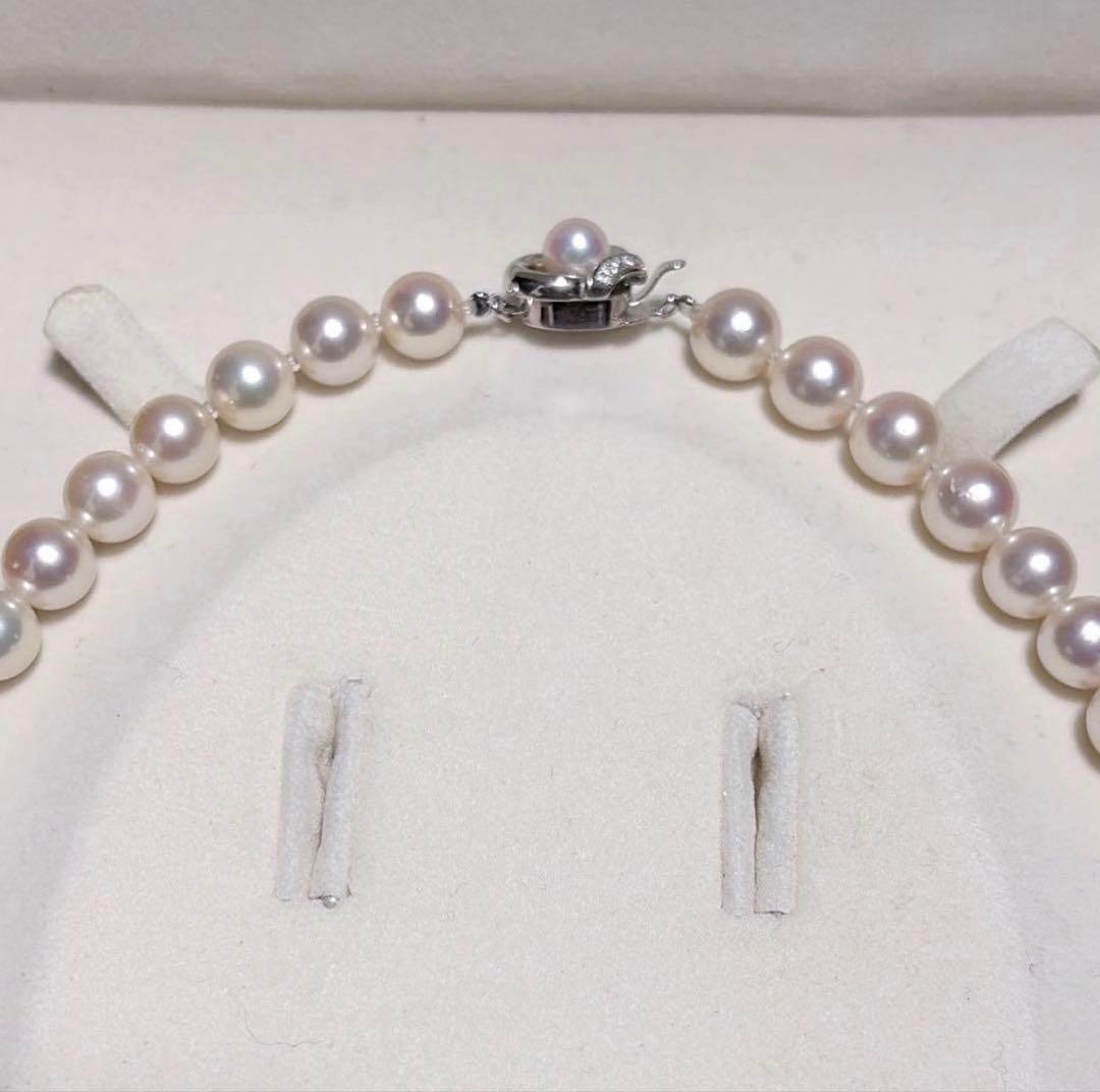TASAKI Akoya Pearl Necklace with 8.0-8.5 mm pearls and 42 cm length displayed on a black background