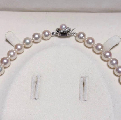 TASAKI Akoya Pearl Necklace with 8.0-8.5 mm pearls and 42 cm length displayed on a black background