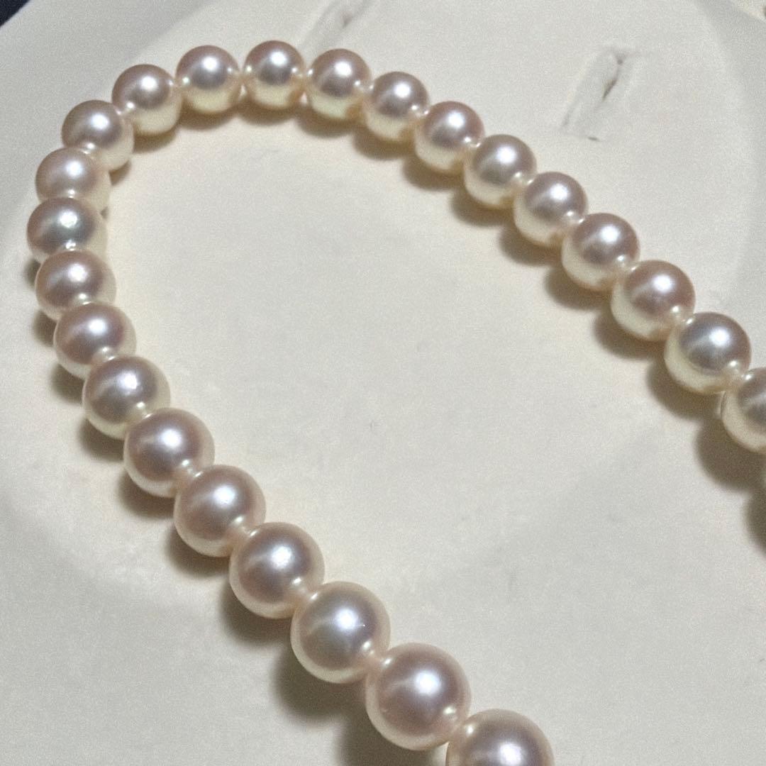 TASAKI Akoya Pearl Necklace with 8.0-8.5 mm pearls and 42 cm length displayed on a black background