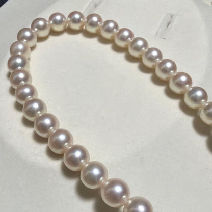 TASAKI Akoya Pearl Necklace with 8.0-8.5 mm pearls and 42 cm length displayed on a black background