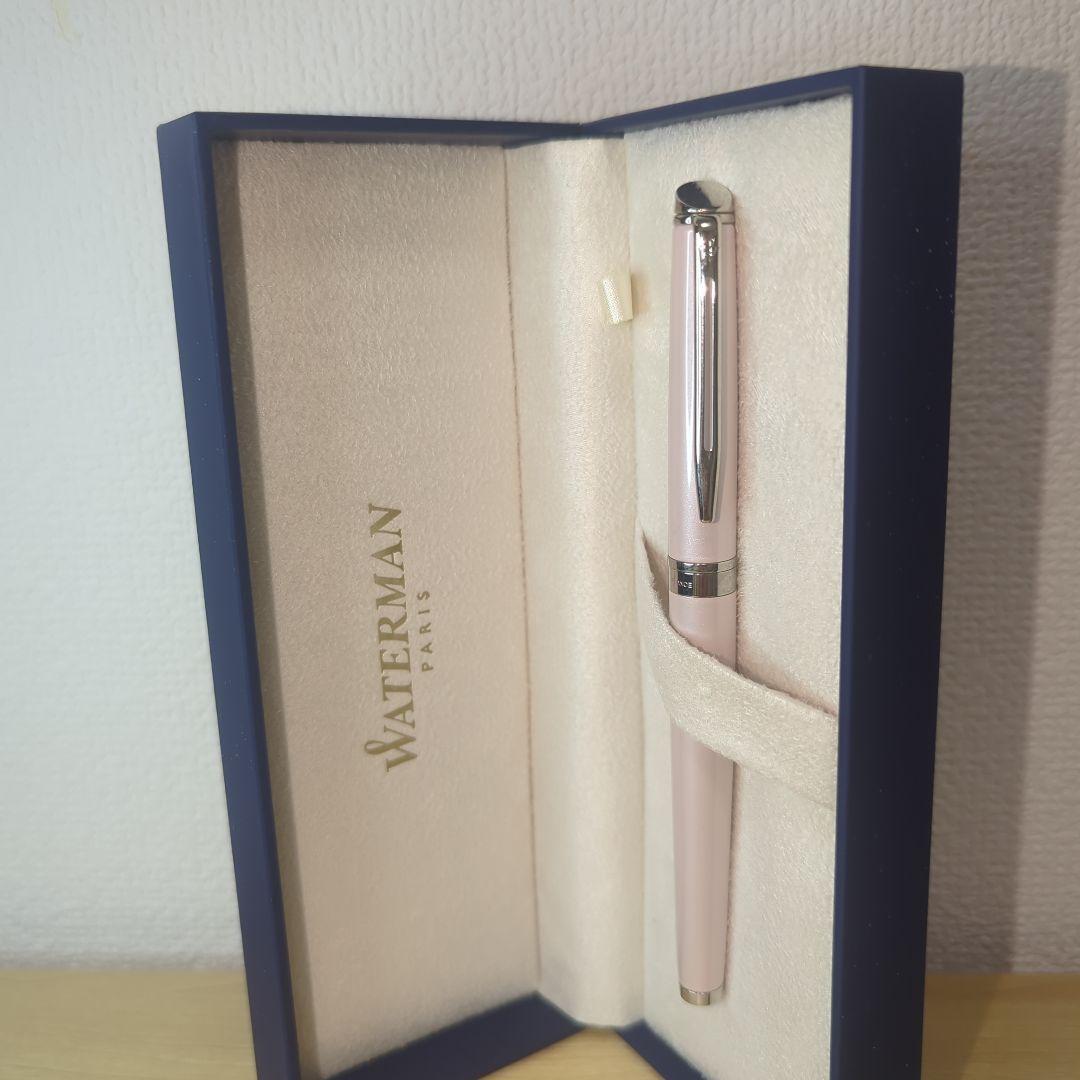 Pink WATERMAN Metropolitan series fountain pen with its storage case on a white background