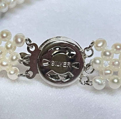 High-quality Aurora colored 5-row V-shaped Akoya pearl necklace with semi-round 3mm pearls and silver floral clasp